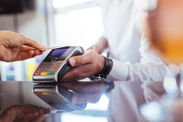 Man making card payment.