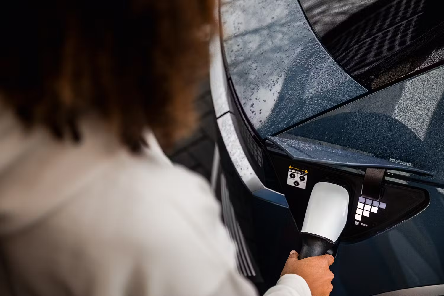 Woman Charging her car