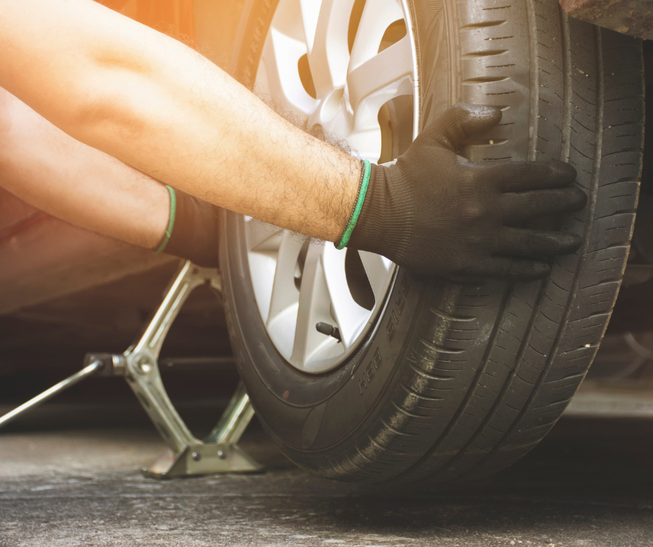 CAR WHEEL BEING CHANGED