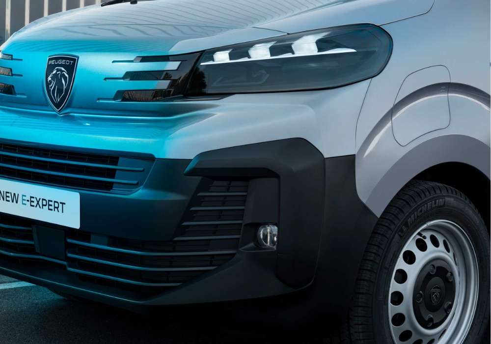 Peugeot e-Expert front grille and bumper detail with steel wheel visible.