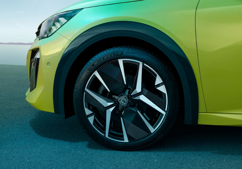 Peugeot 208 alloy wheel detail with Michelin tyre and distinctive multi-spoke design.