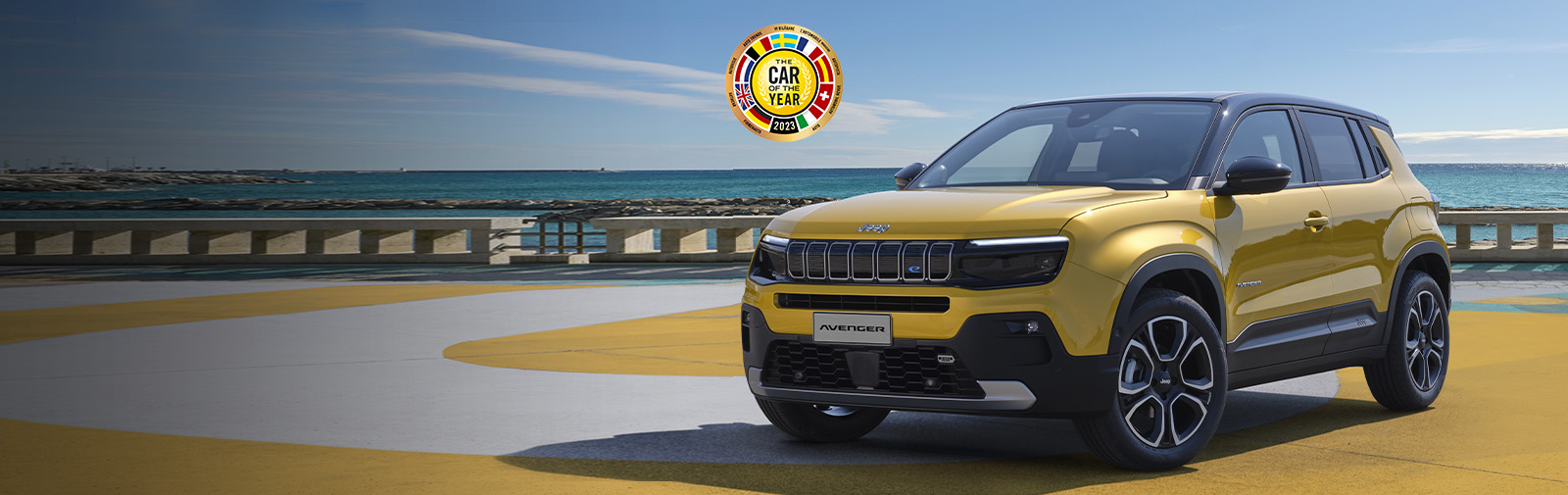 Yellow JEEP Avenger by the beach