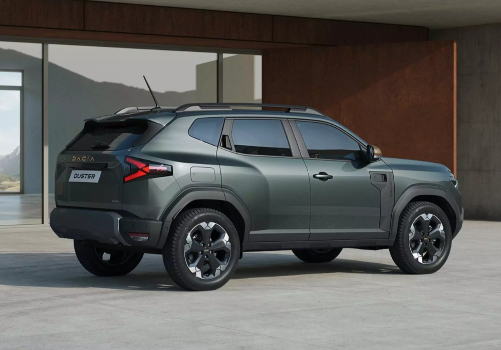 Dacia Duster parked in a contemporary outdoor space, highlighting side profile and strong SUV proportions.
