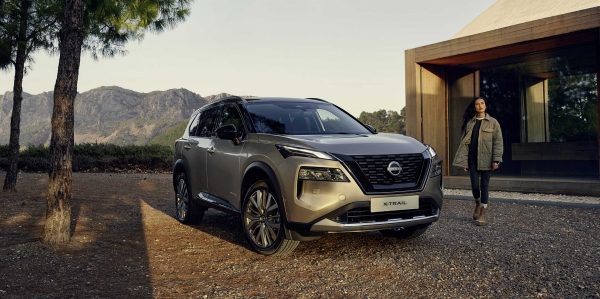 Nissan XTrail parked outside of modern house
