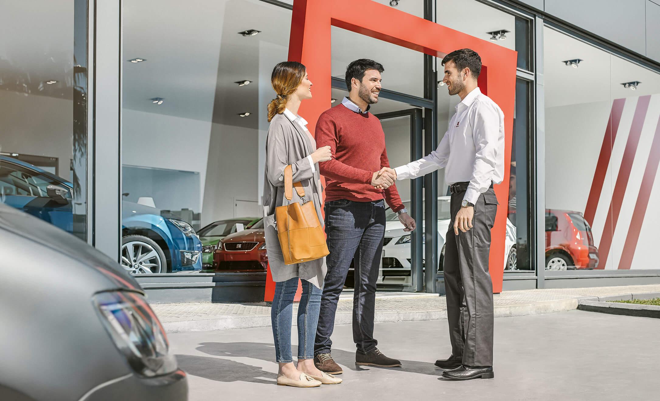 Customers with salesman outside SEAT showroom