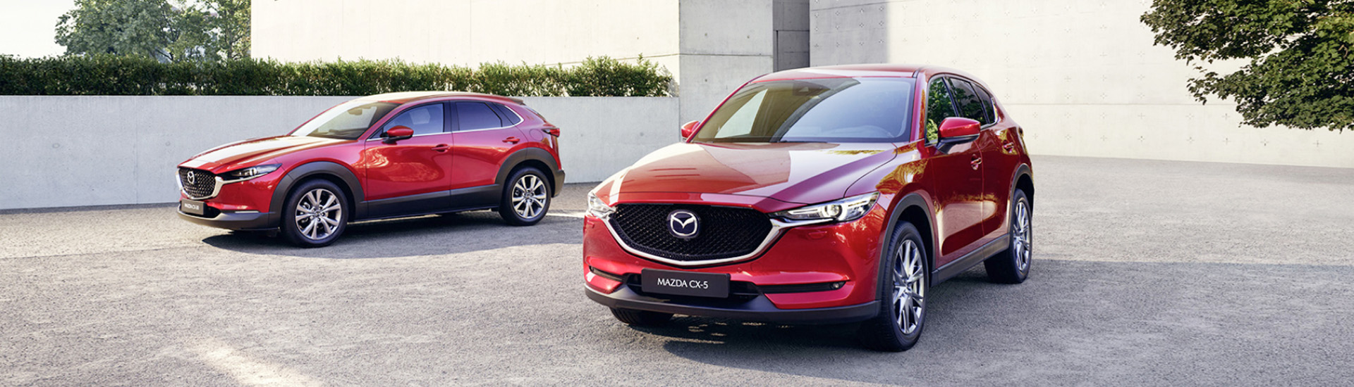 Red mazda suv cars parked outdoors