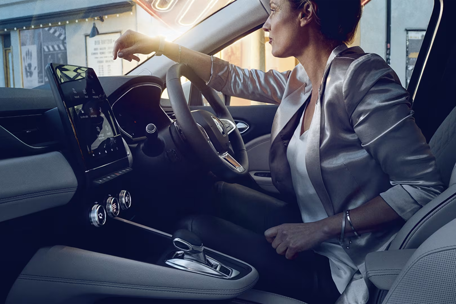 woman sat in a renault vehicle