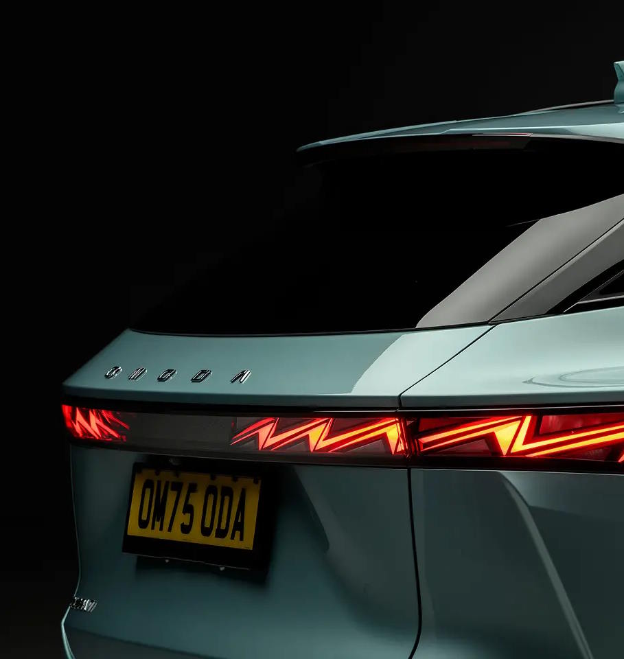 Close-up rear view of the Peugeot 3008 SUV in Iced Grey, featuring the striking full-width LED tail light bar with distinctive three-claw signature design.