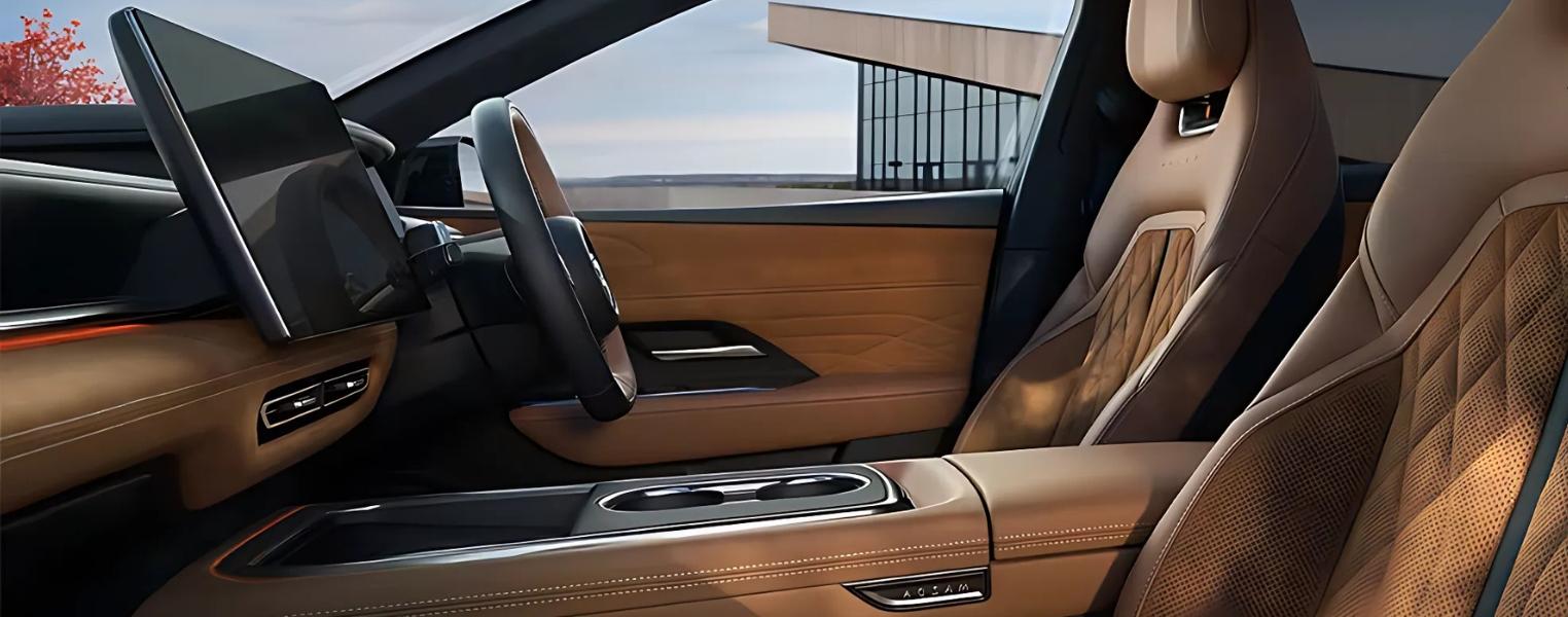 Detailed view of Mazda6e cabin highlighting wheel, screen, seating, and console design.