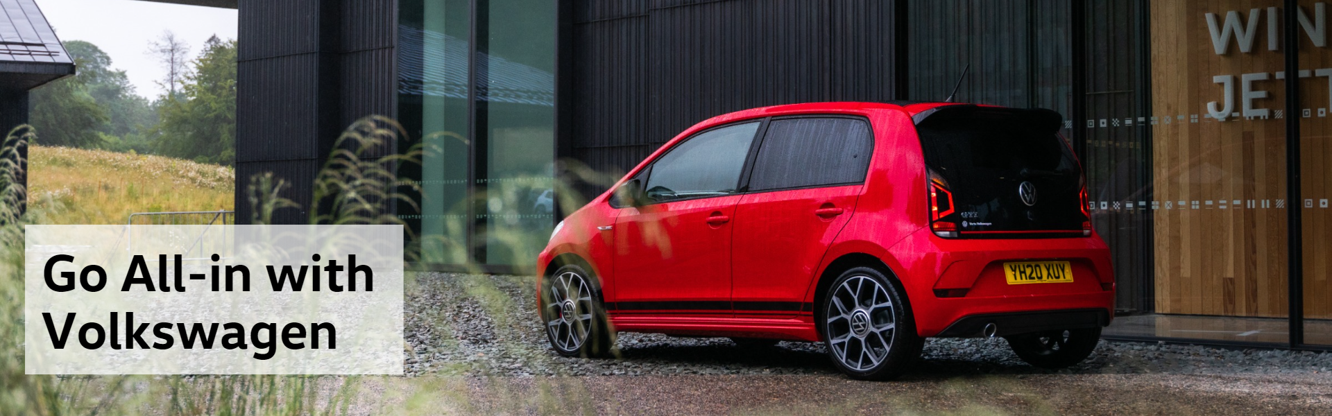 Volkswagen All-in banner with red VW Up
