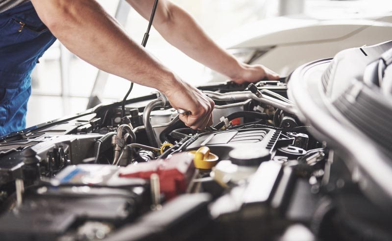 Mechanic Working On Engine