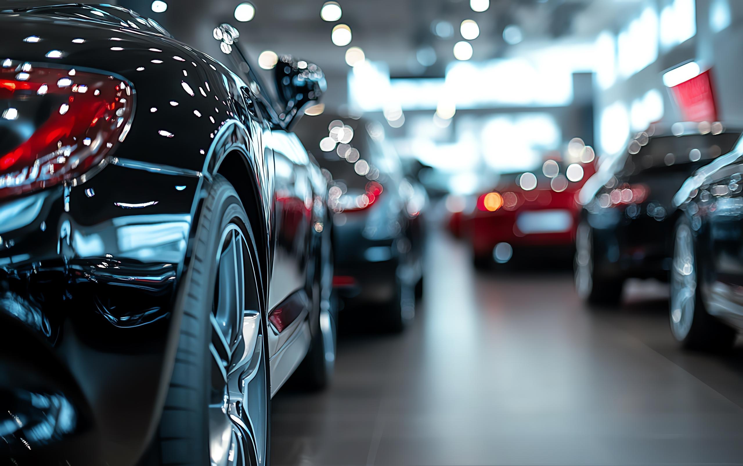 blurred image of a car showroom