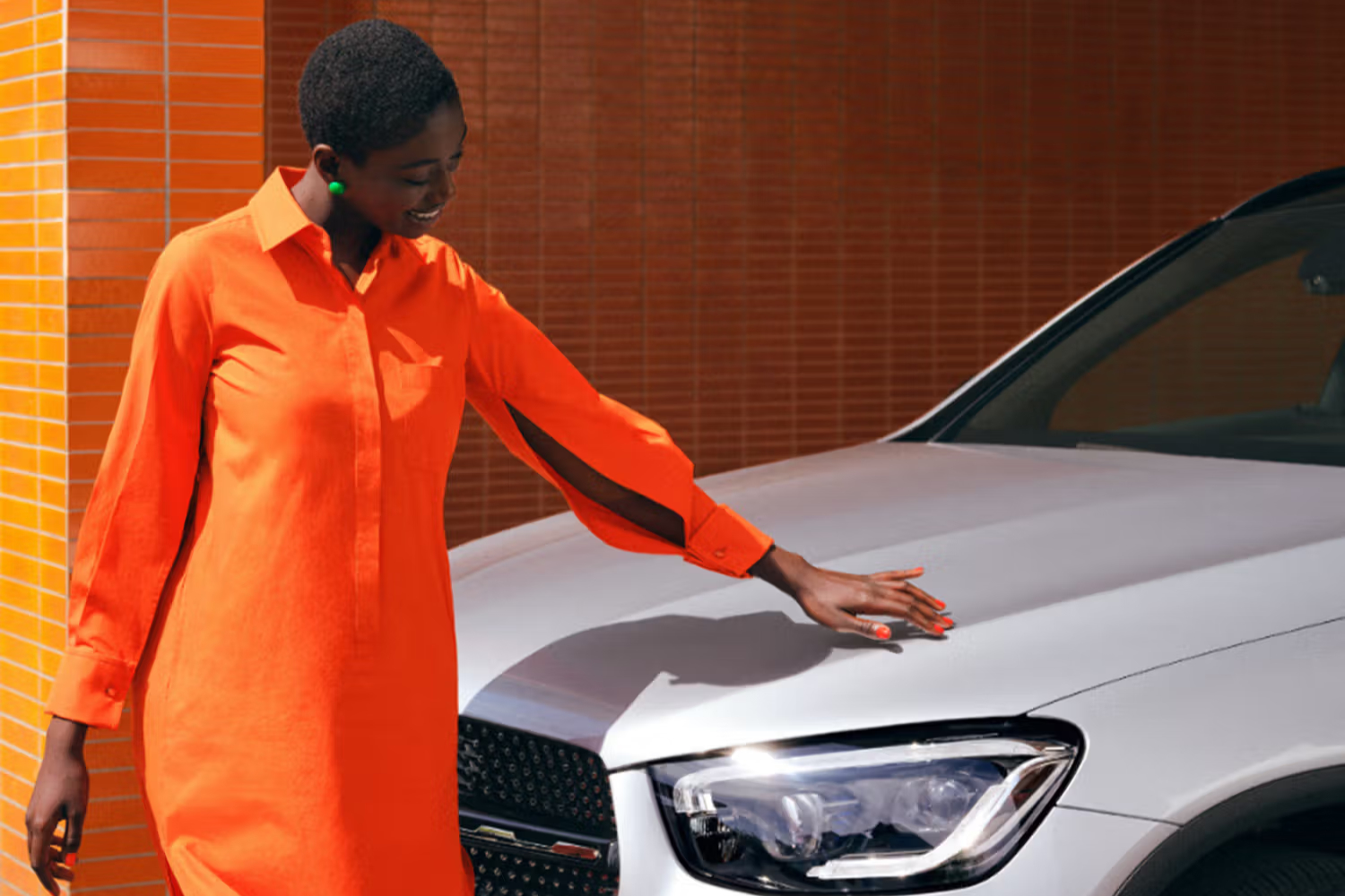 Person stood by Silver Mercedes-Benz