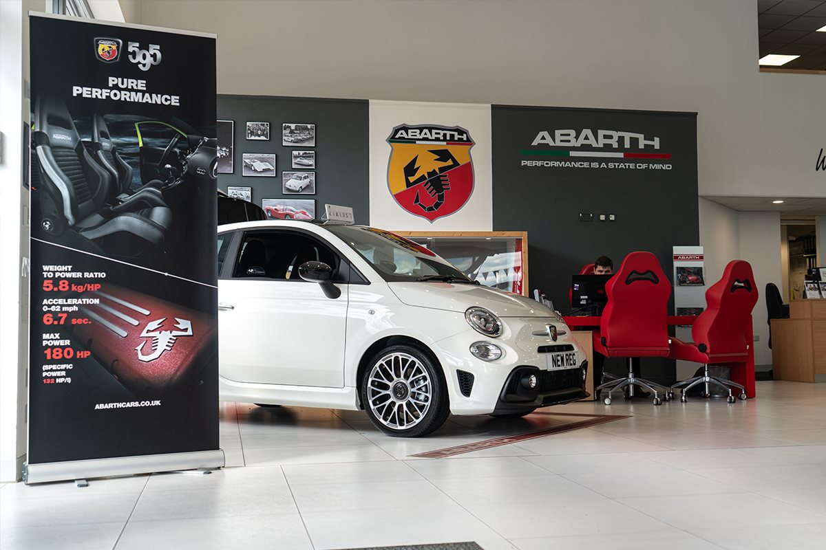 new white abarth inside showroom