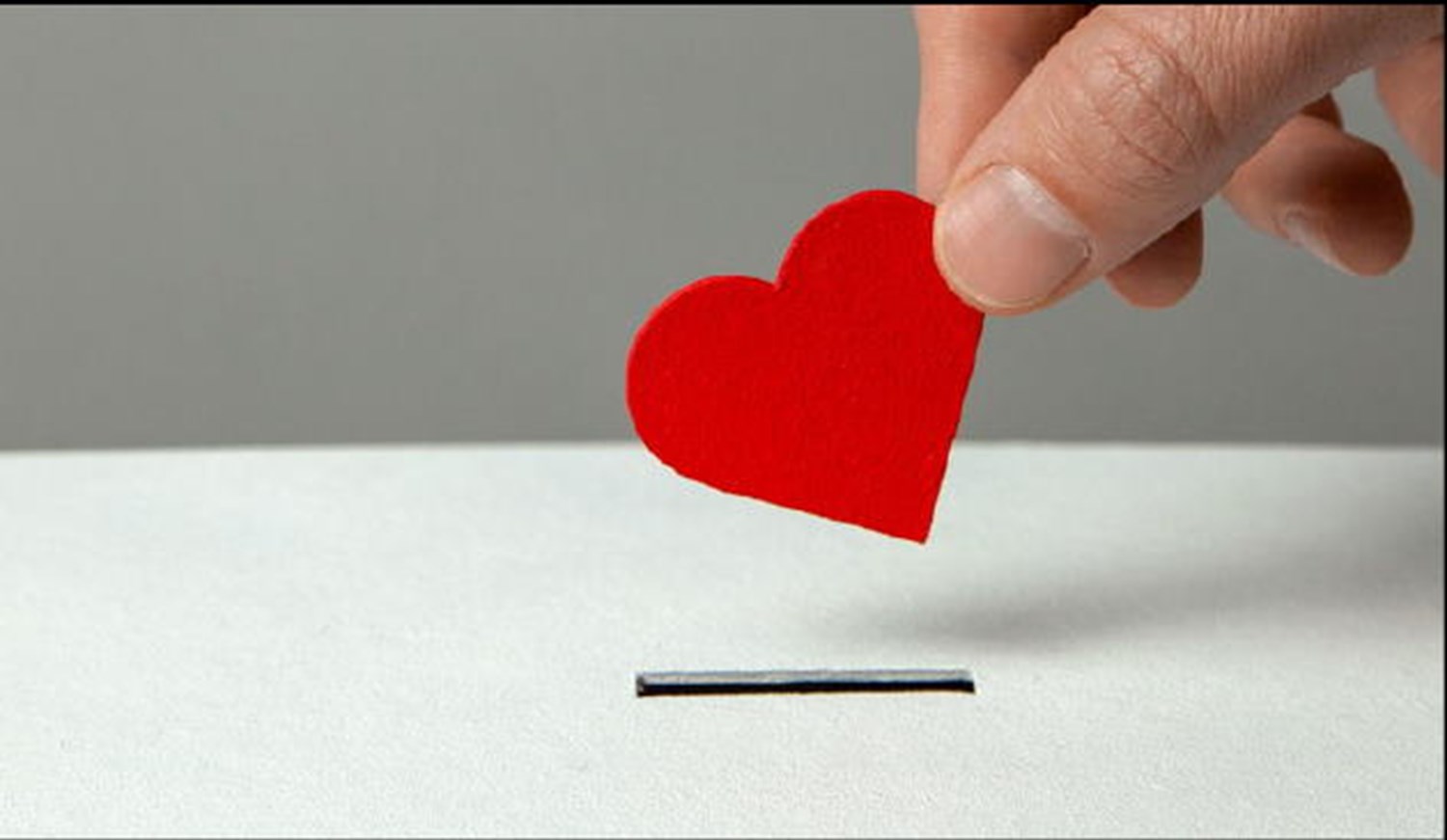 Love Heart being put through a slot