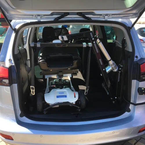 Motability Scooter folded away in the back of a car.