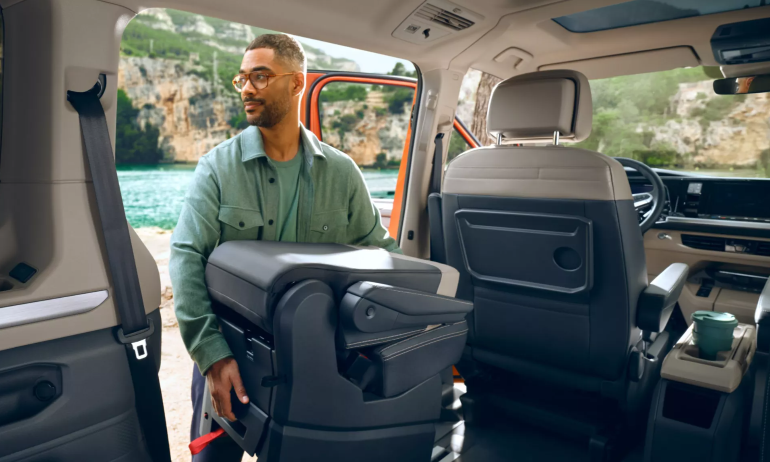 Person taking seat out of new Volkswagen Multivan