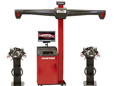 Hunter wheel alignment system with digital measuring equipment and alignment sensors used for vehicle wheel calibration and tracking adjustments.