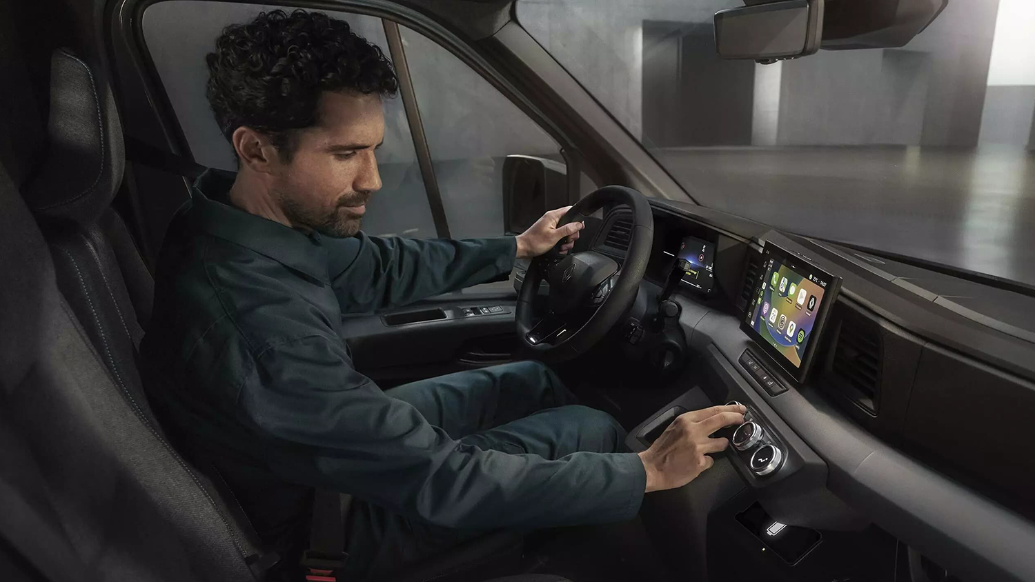 man using touchscreen in van