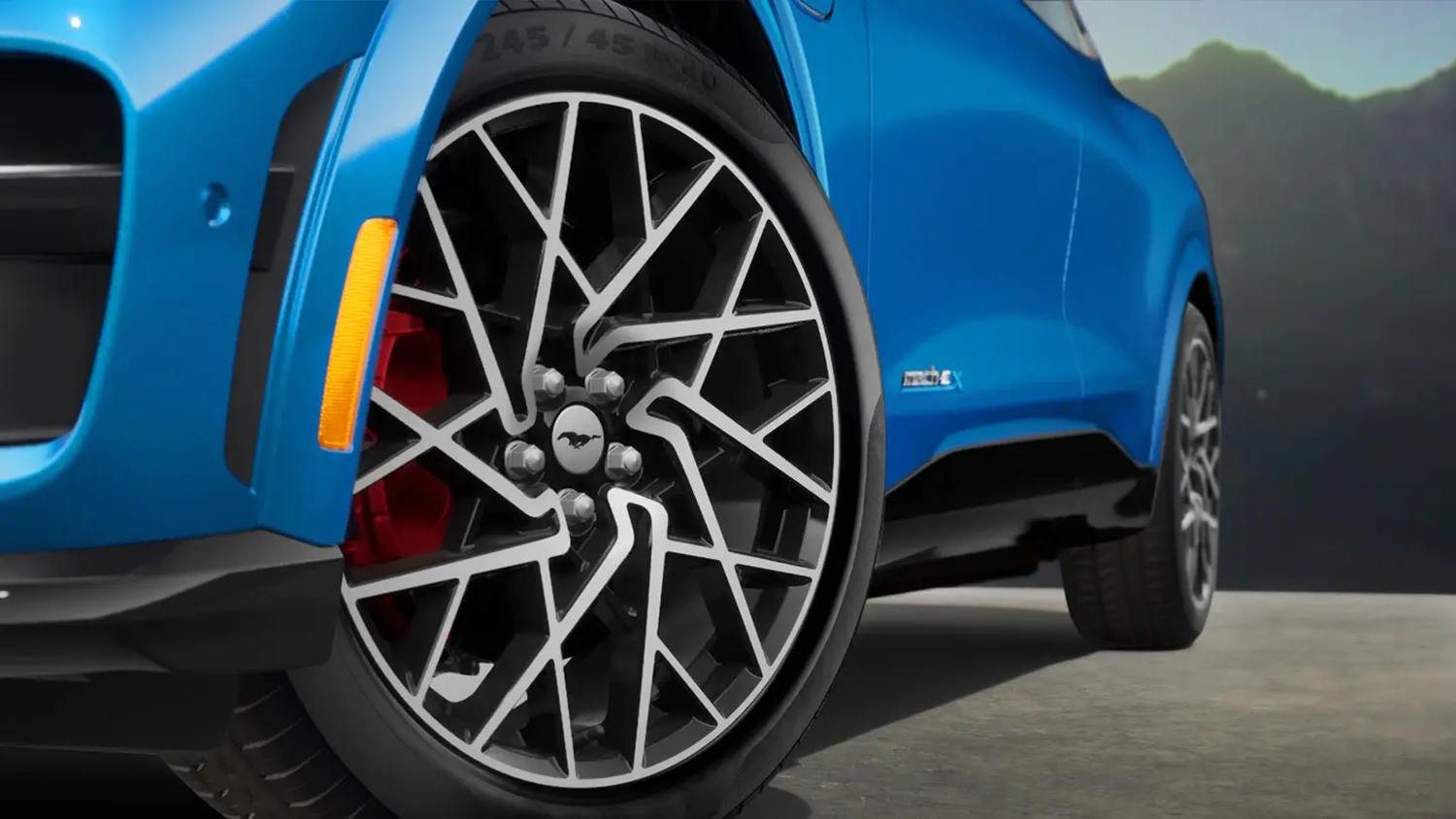wheels of a blue ford mustang