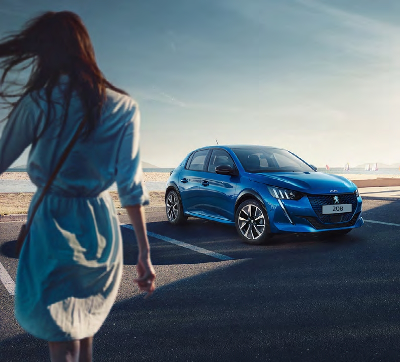 lady by a Peugeot 208