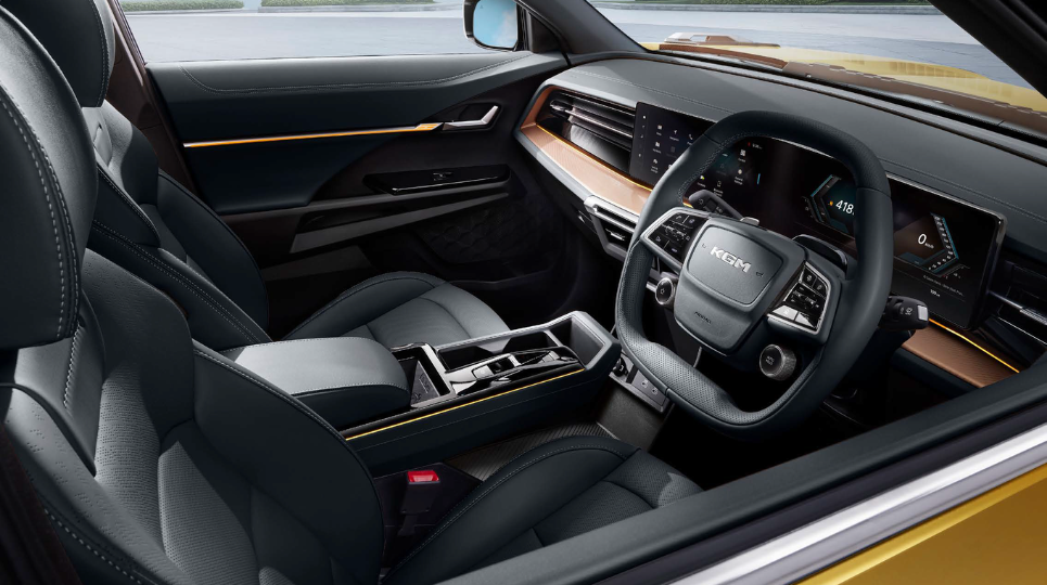 KGM Musso EV interior with steering wheel and dashboard