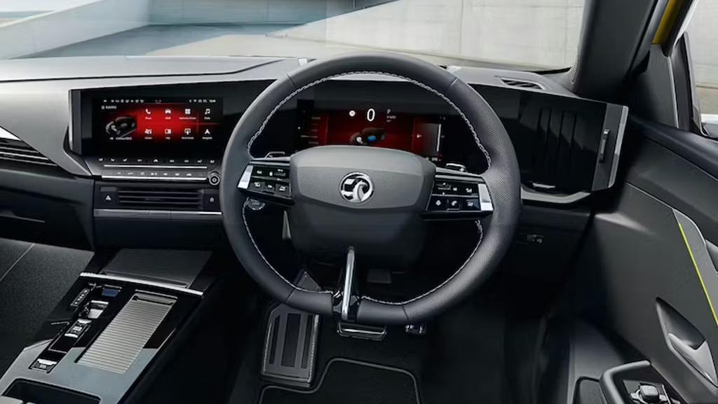 Vauxhall Astra cockpit featuring dual digital displays, a multifunction steering wheel and a minimalist dashboard.