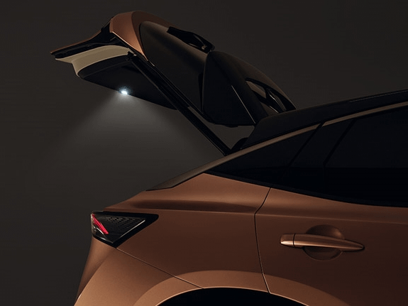 Close-up of a Nissan Qashqai rear with the powered tailgate opening, showing integrated lighting.