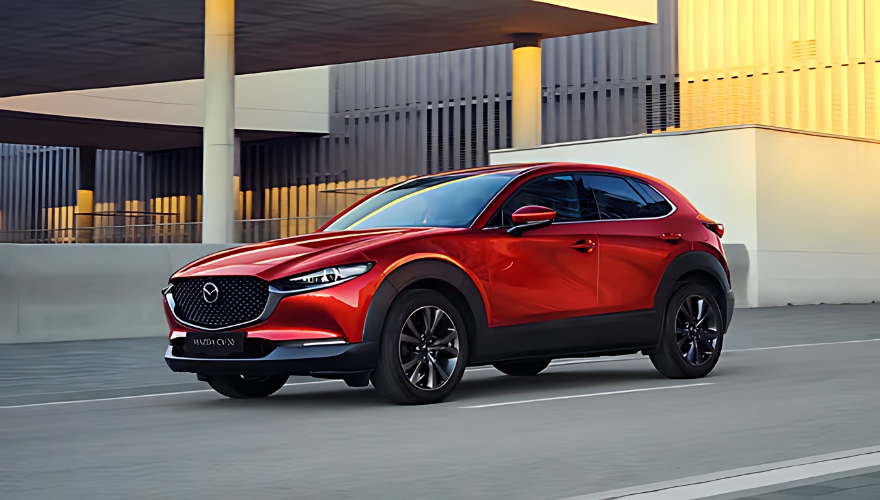 Red Mazda CX-30 SUV showcased in a modern urban environment.