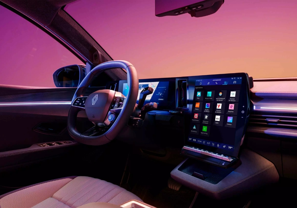 Interior cockpit view of Renault Scenic E-Tech featuring digital driver display and large vertical touchscreen infotainment system.