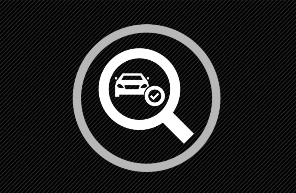 Magnified glass over vehicle icon
