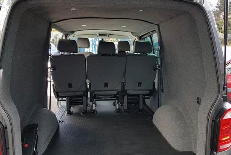 Grey interior lining viewing from the angle of the boot doors