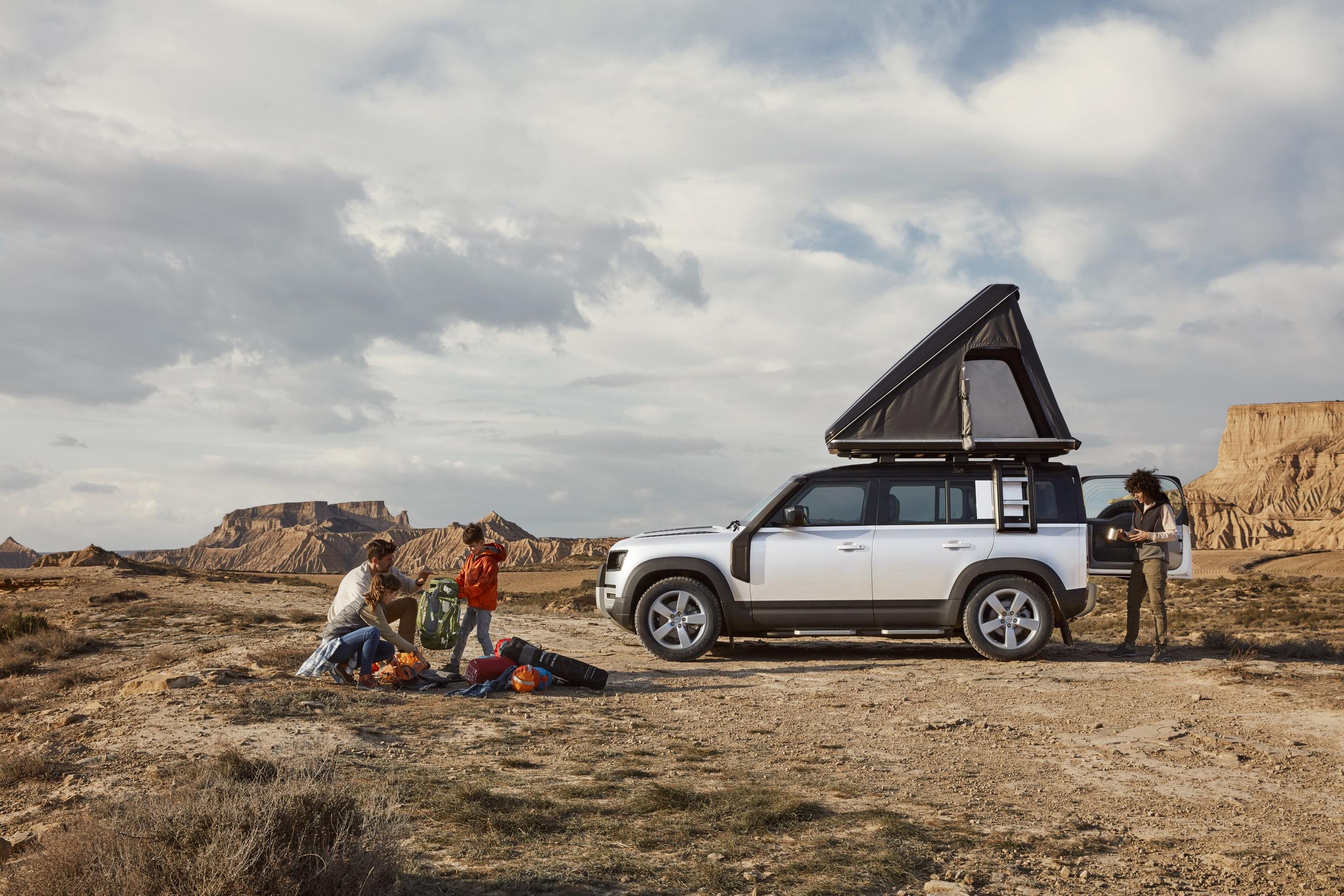 White Defender 130 Side View With Roof Tent
