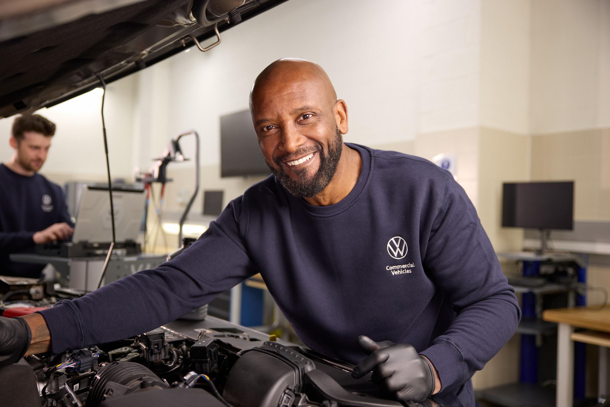 Volkswagen Mechanic Inspecting Engine
