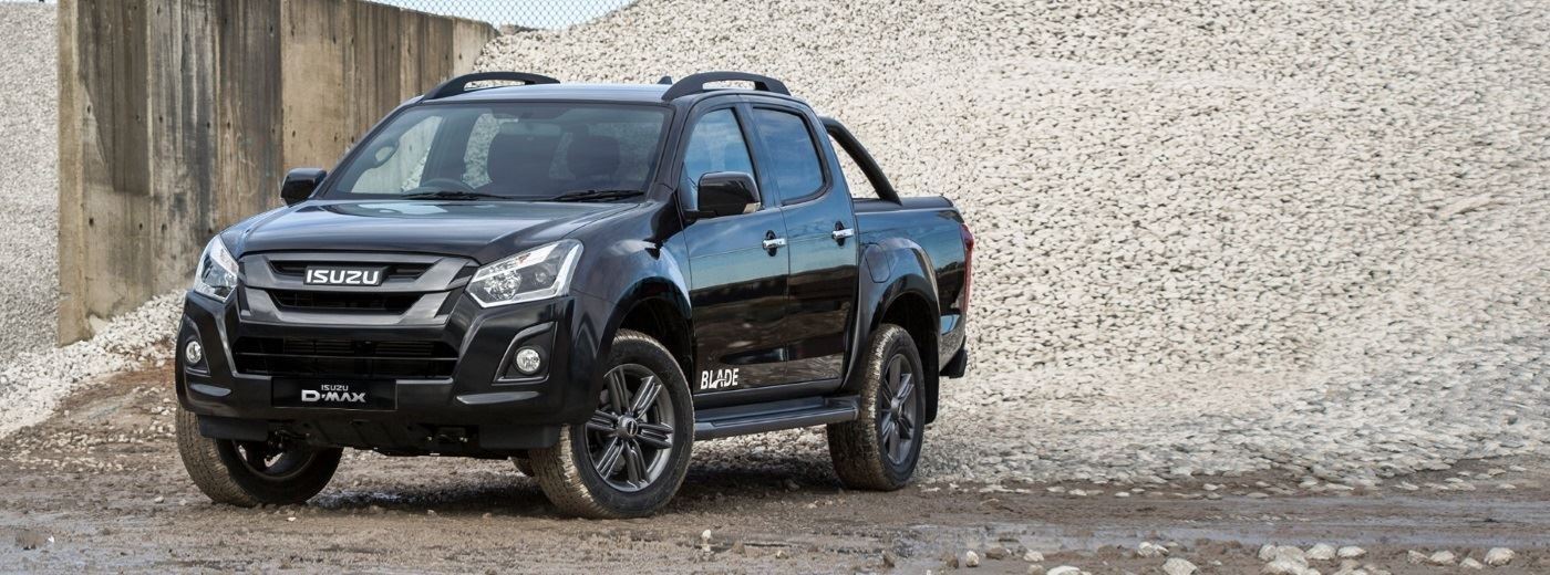 Black Isuzu D-Max parked on gravel