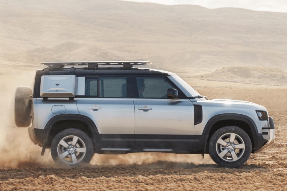 Land Rover Driving In Sand Side View