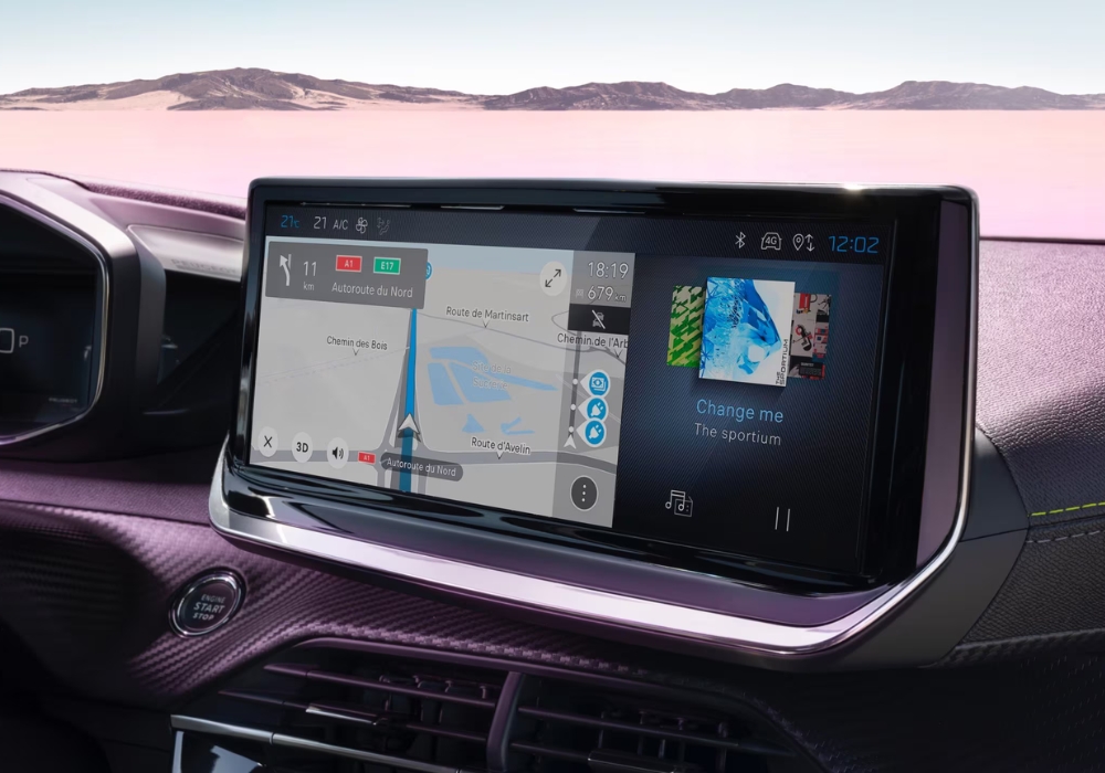 Peugeot 2008 touchscreen displaying navigation map and media interface on the dashboard.