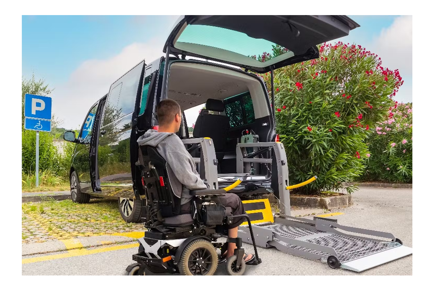 man in wheelchair getting into adapted vehicle