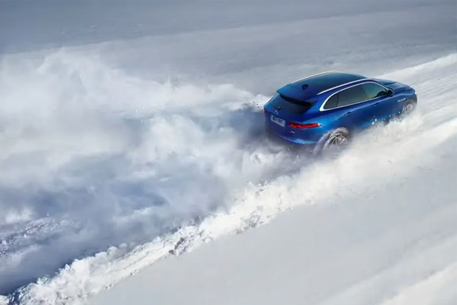 Jaguar Driving In Snow