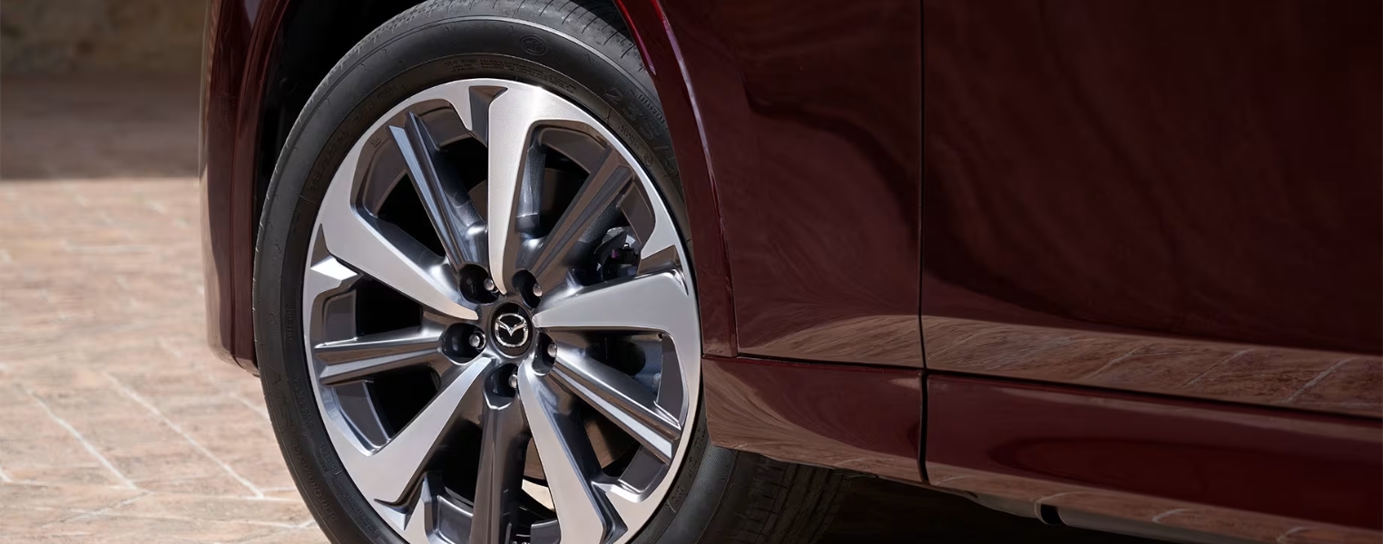 Close-up of Mazda CX-80 alloy wheel design.