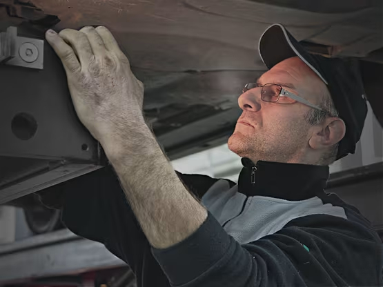 service technician working on car