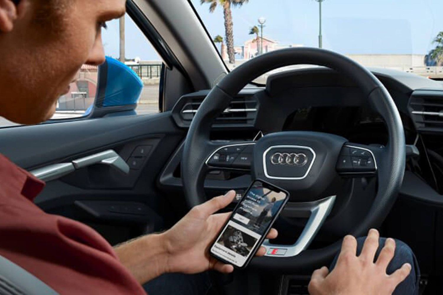 Person On Audi App in Audi Vehicle