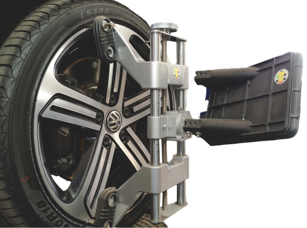 Wheels being aligned on car