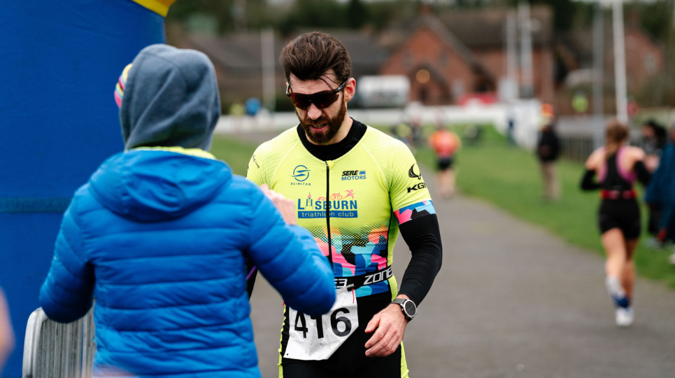 Man collecting medal at SERE Lisburn Duathlon