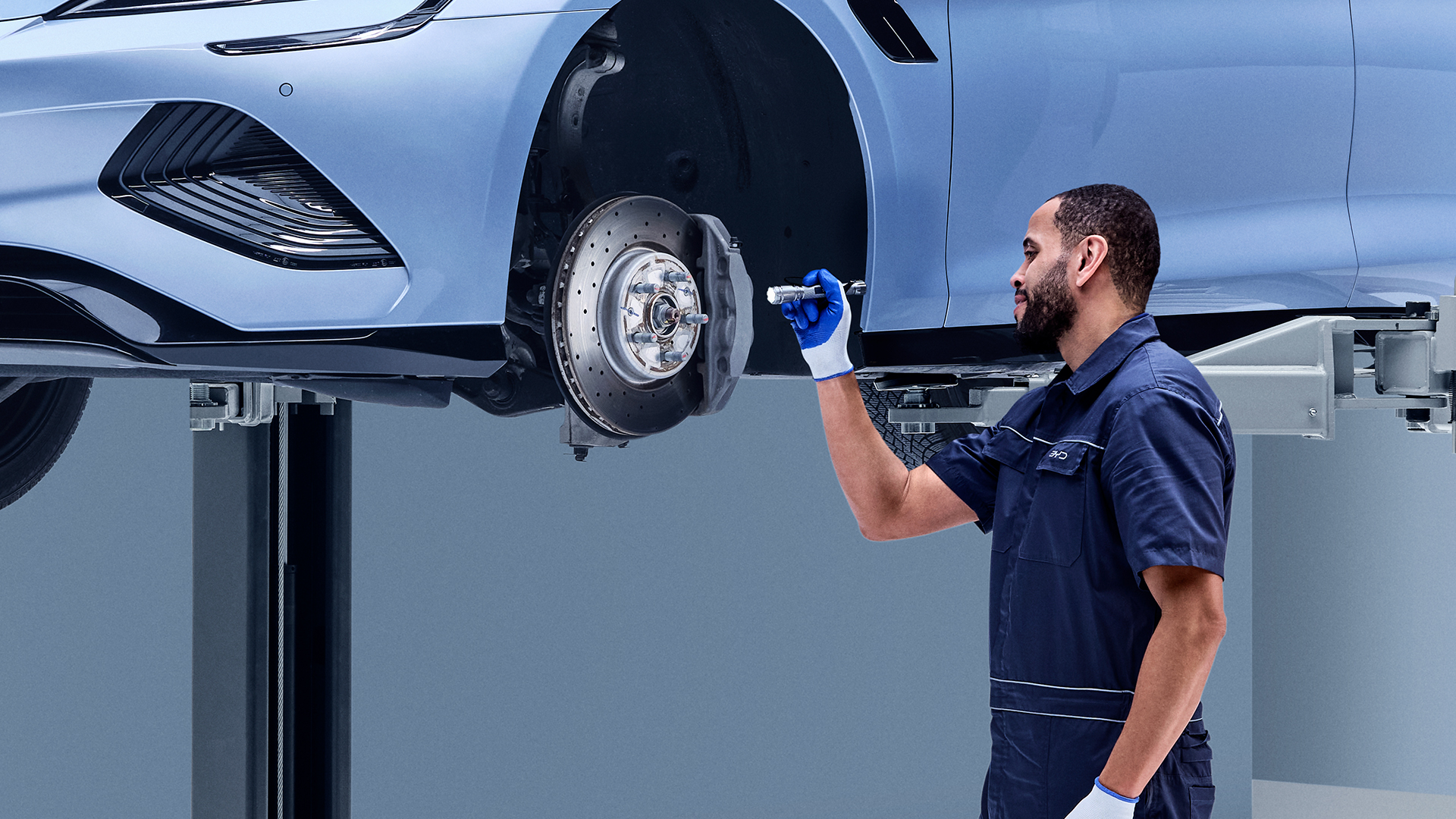 BYD Mechanic Inspecting Brake discs