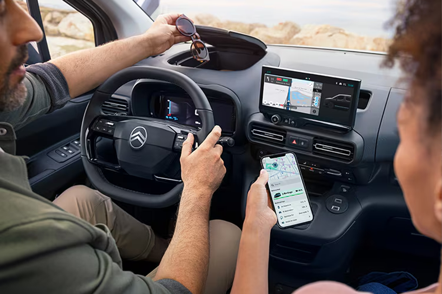 two people in the front seats of ë-berlingo on the electroverse app