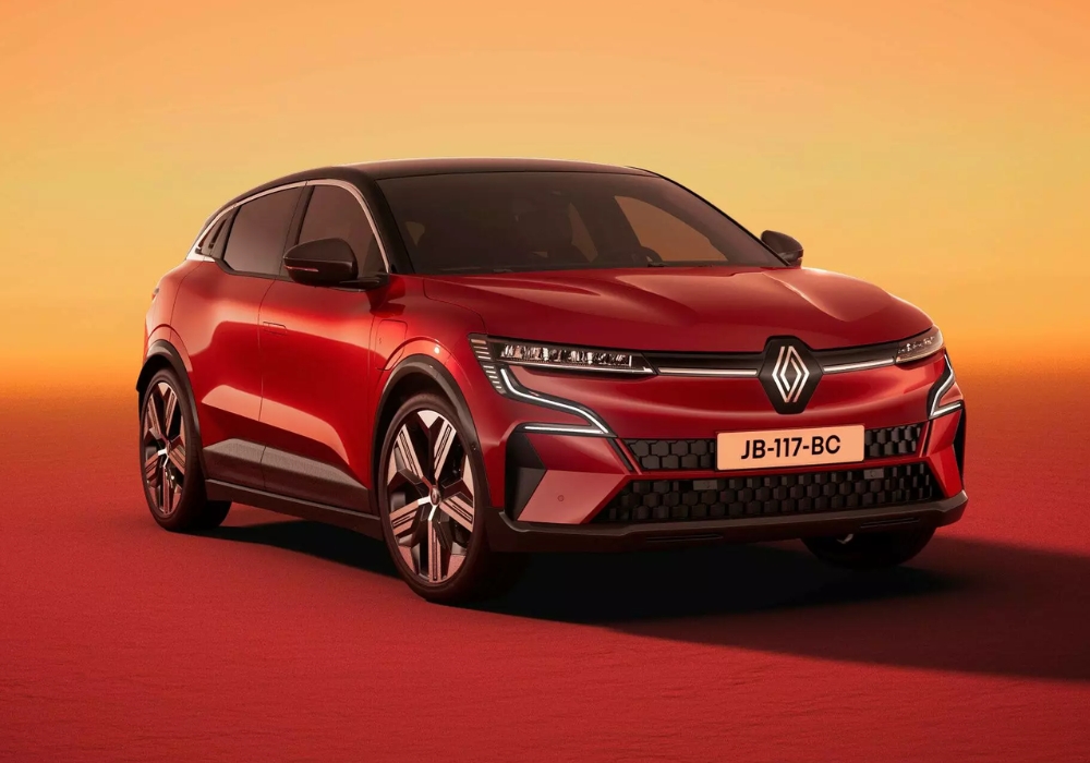 Red Renault Megane E-Tech electric SUV in a studio setting, shown from the front three-quarter angle.