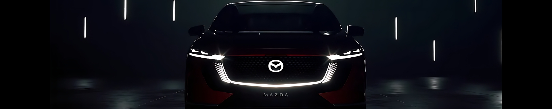 Mazda6e with front lights lit up.