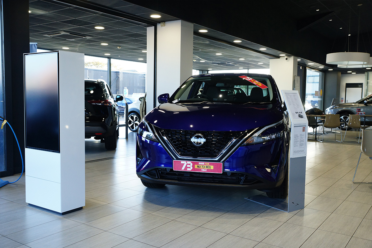 new nissan cars in showroom