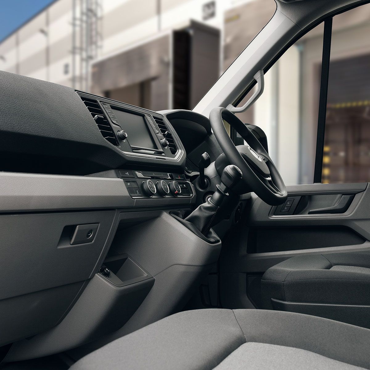 Van interior showing dashboard layout, steering wheel and centre controls.